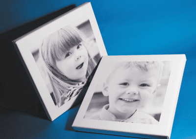 two canvas frames of a boy and girl kids