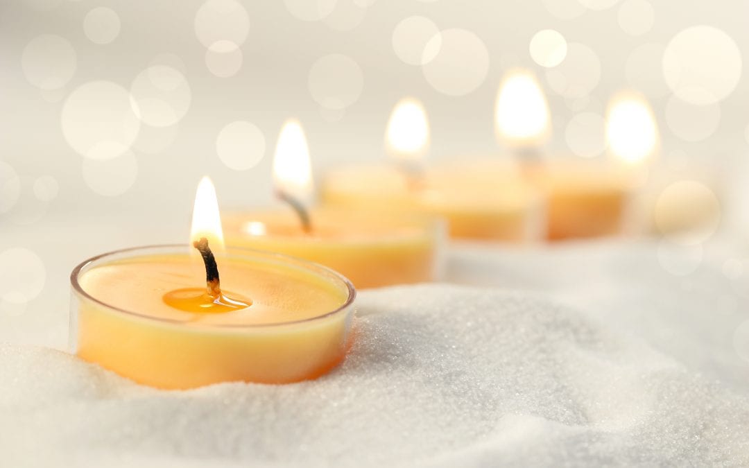 Votive candles in sand