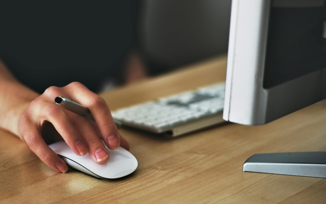 Person Holding Apple Magic Mouse